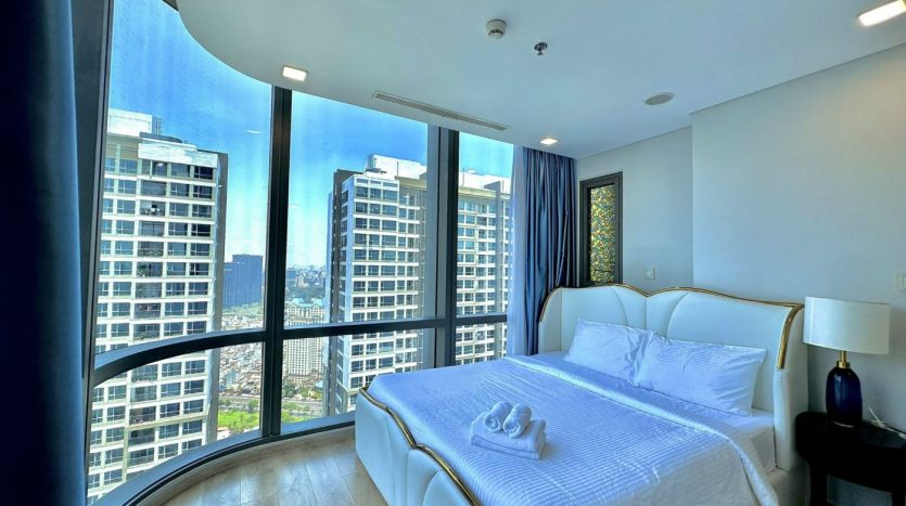 Large bedroom with panoramic view of city