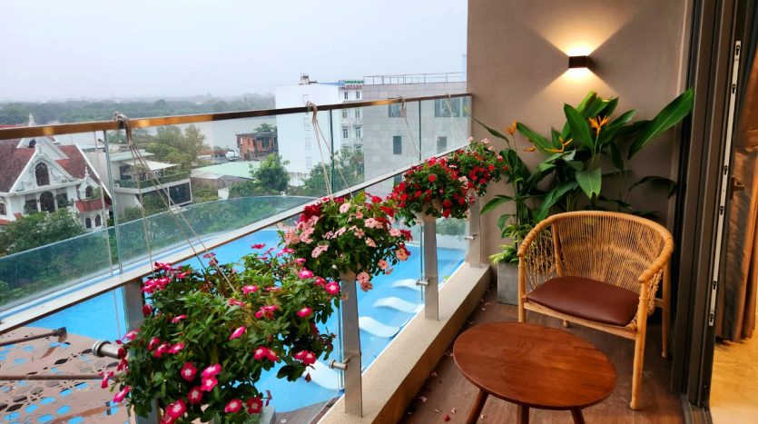 Chill balcony overlooking swimming pool