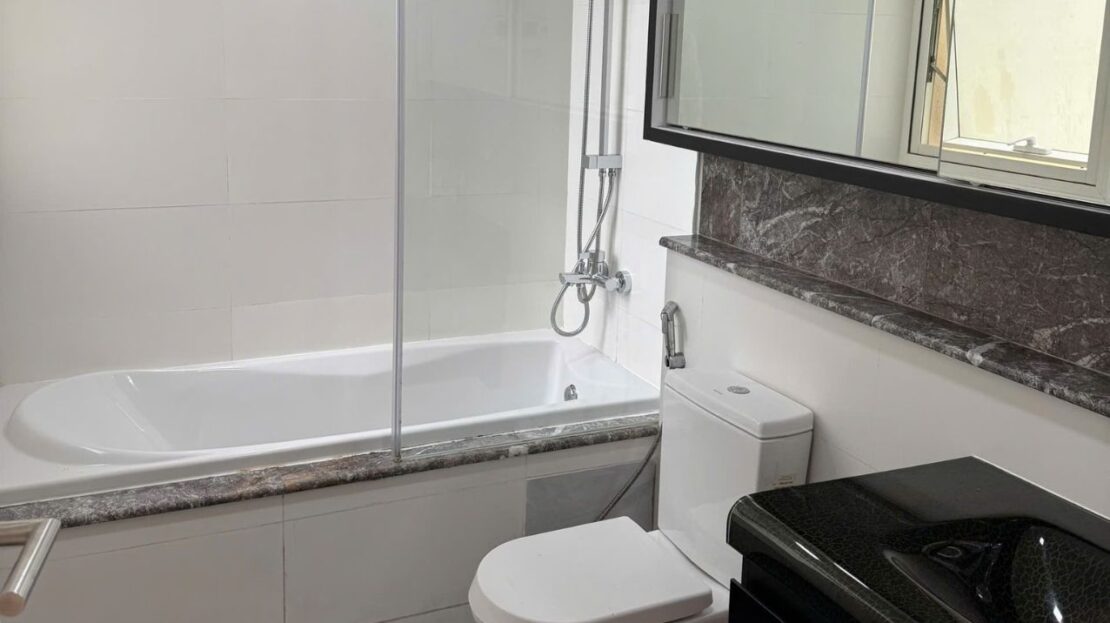 Bathroom with bathtub, overhead shower and mirror cabinet, The Estella 2BR apartment