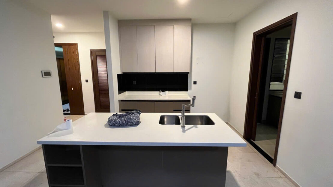 Kitchen island with double sink and fitted cabinets, D'edge Thao Dien 3BR for rent