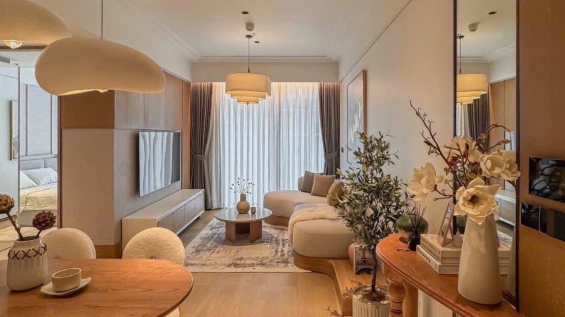 Open living and dining space with TV wall, 1-bedroom Grand Marina Saigon apartment