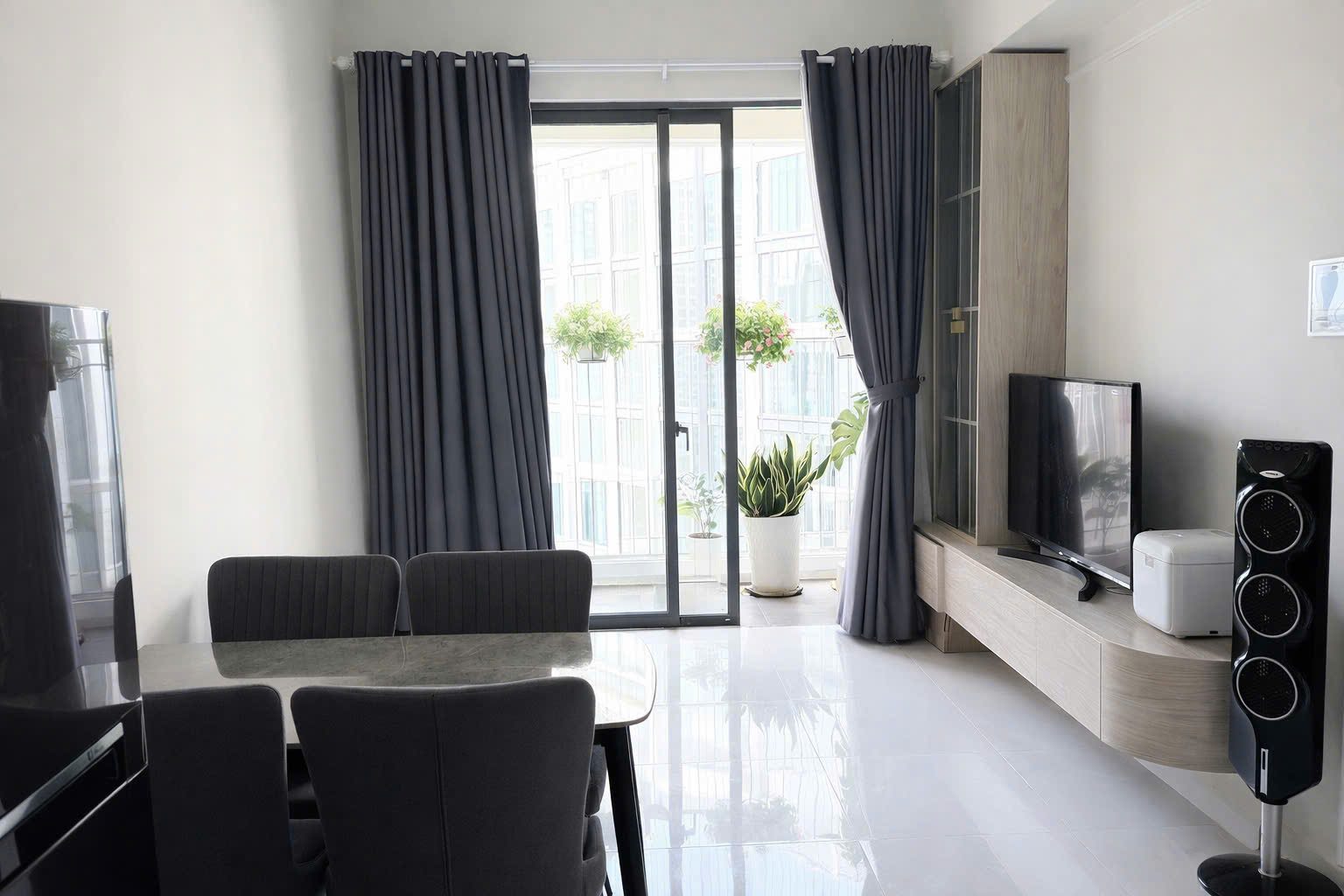 Dining area and balcony of a fully furnished 2-bedroom apartment for rent at Masteri An Phu