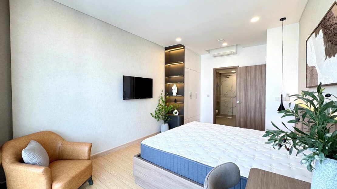 Main bedroom with display shelving and en-suite bathroom, Sunwah Pearl apartment