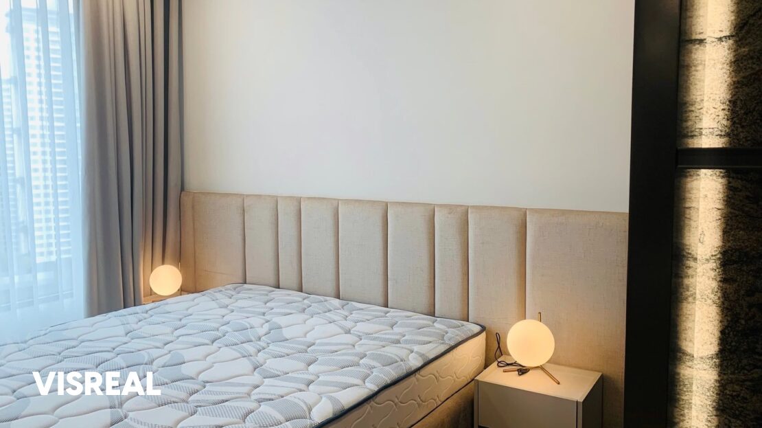 Main bedroom with padded headboard and globe lamps, Lumiere Riverside apartment