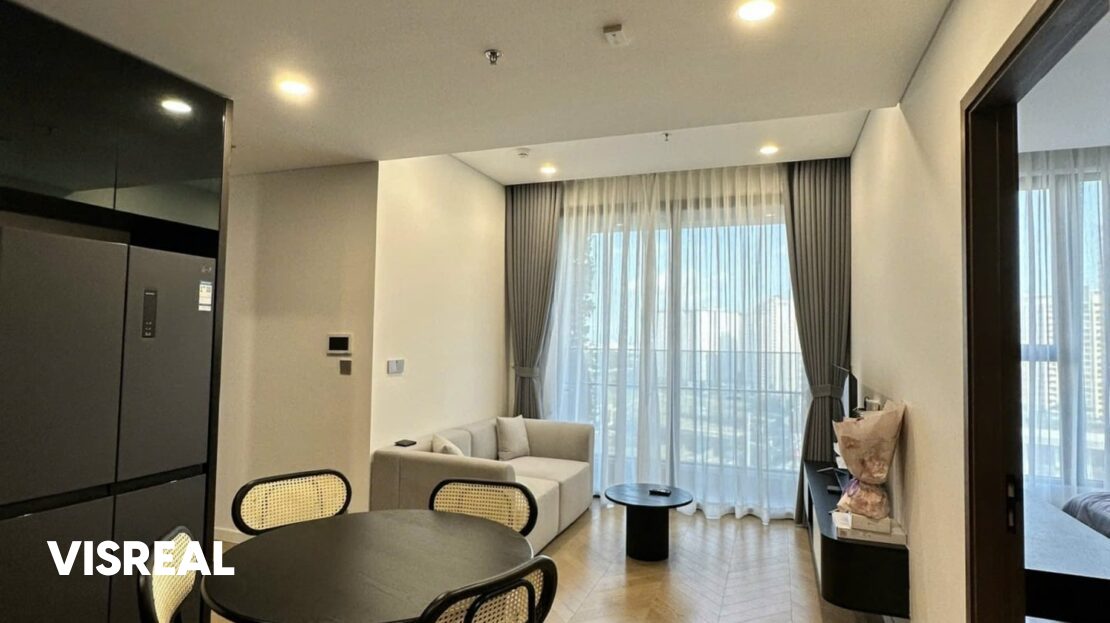 Living room with grey sofa and rattan-back dining chairs, Lumiere Riverside 2BR