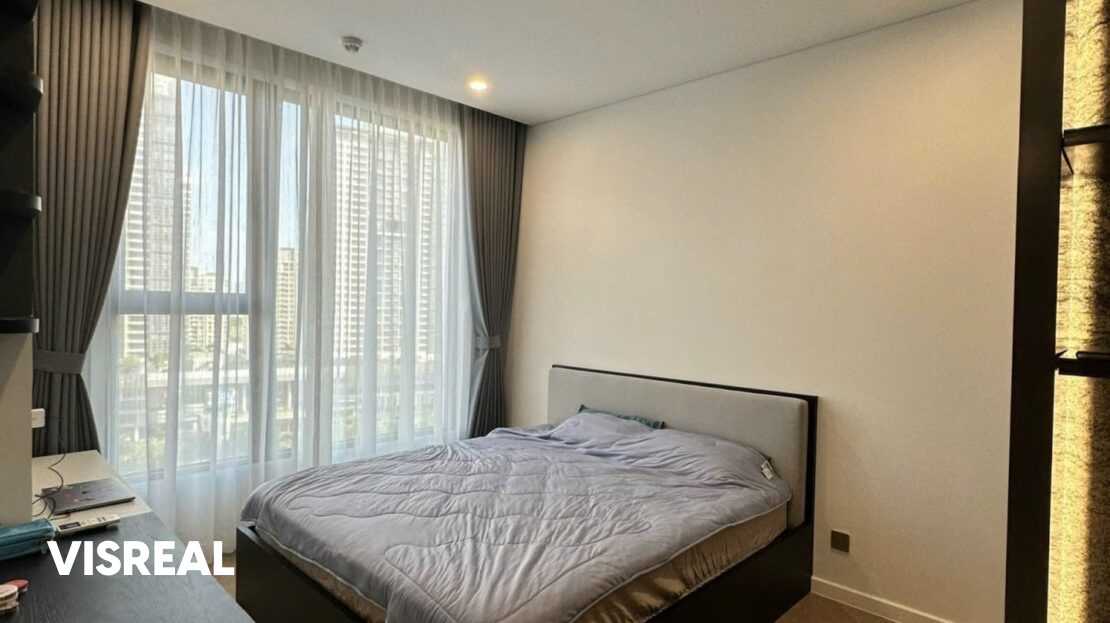 Main bedroom with desk and sheer curtains, pool-view 2-bedroom in Lumiere Riverside