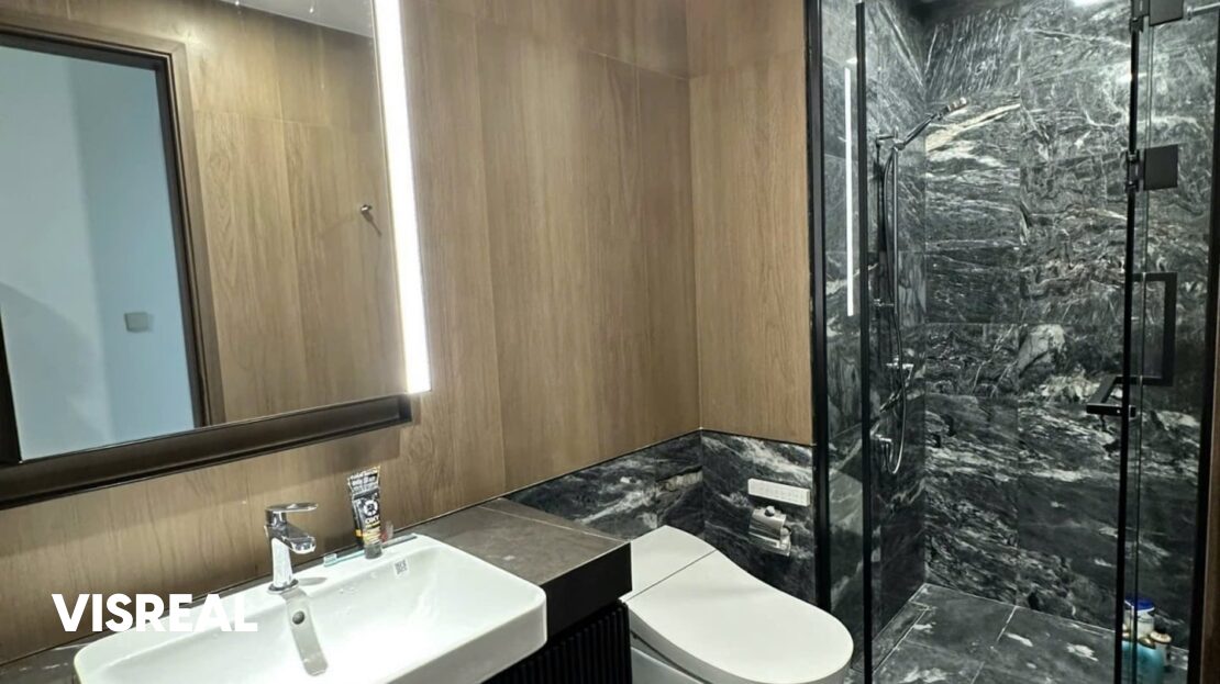 Bathroom with glass shower and lit mirror, 2-bedroom apartment in Lumiere Riverside