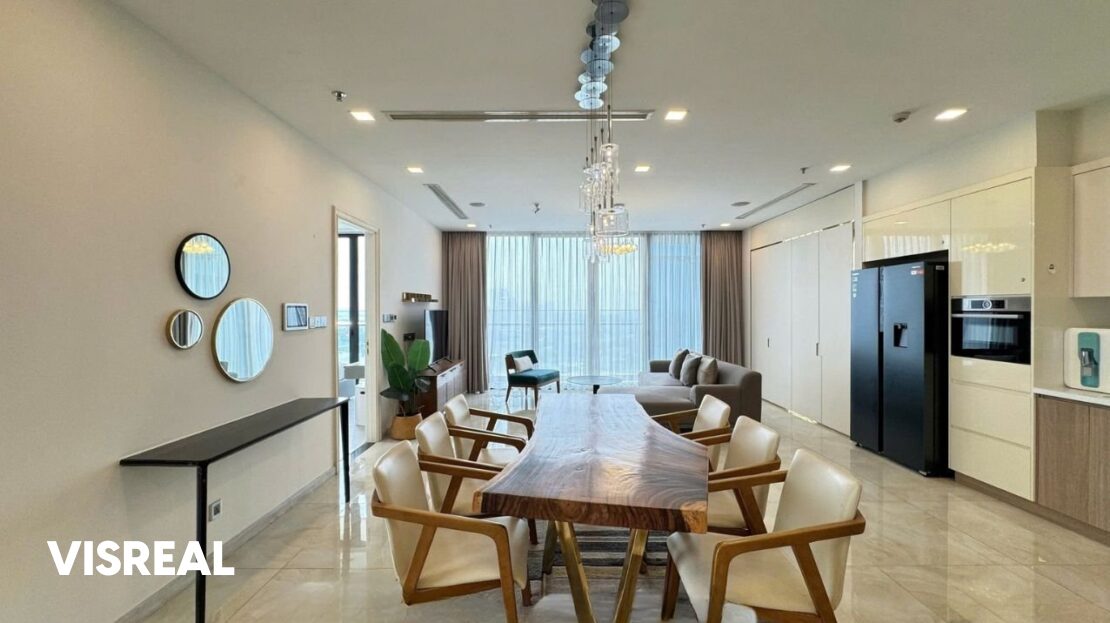Eight-seat dining table under glass pendants looking to the lounge, Vinhomes Golden River rental