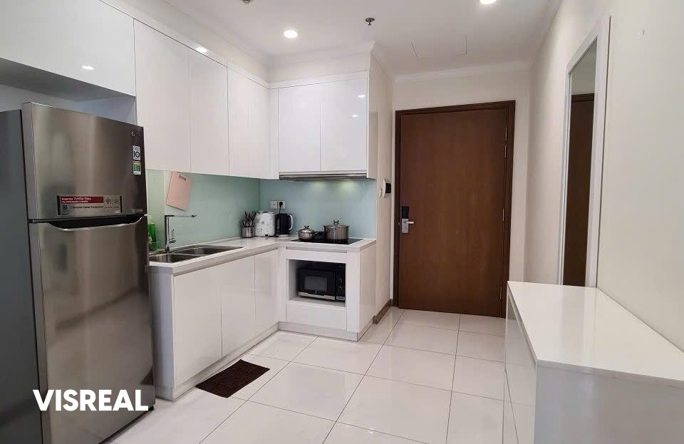 White L-shaped kitchen with hob and microwave niche, Vinhomes Central Park 1-bedroom