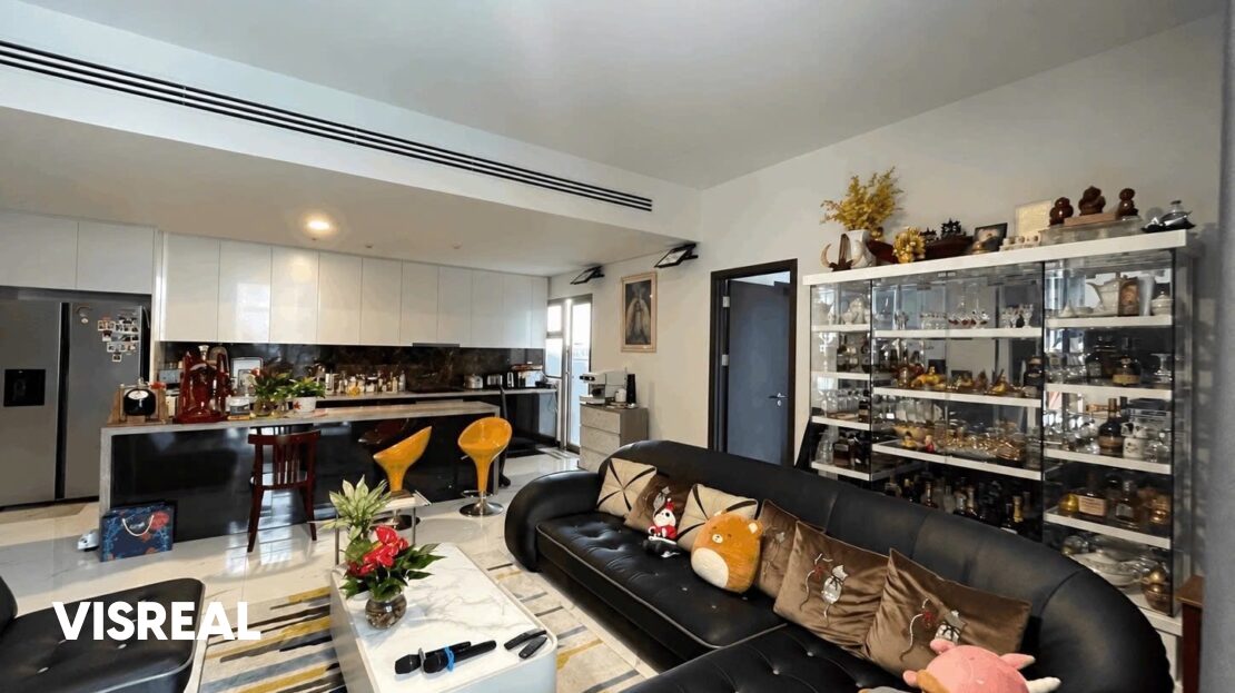 Open living area with kitchen island and display cabinet, Empire City 3BR