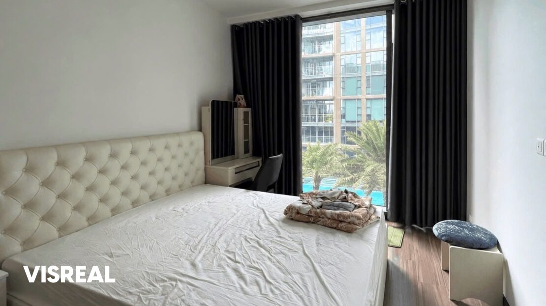 Bedroom with tufted headboard and pool view window, Empire City 3BR rental