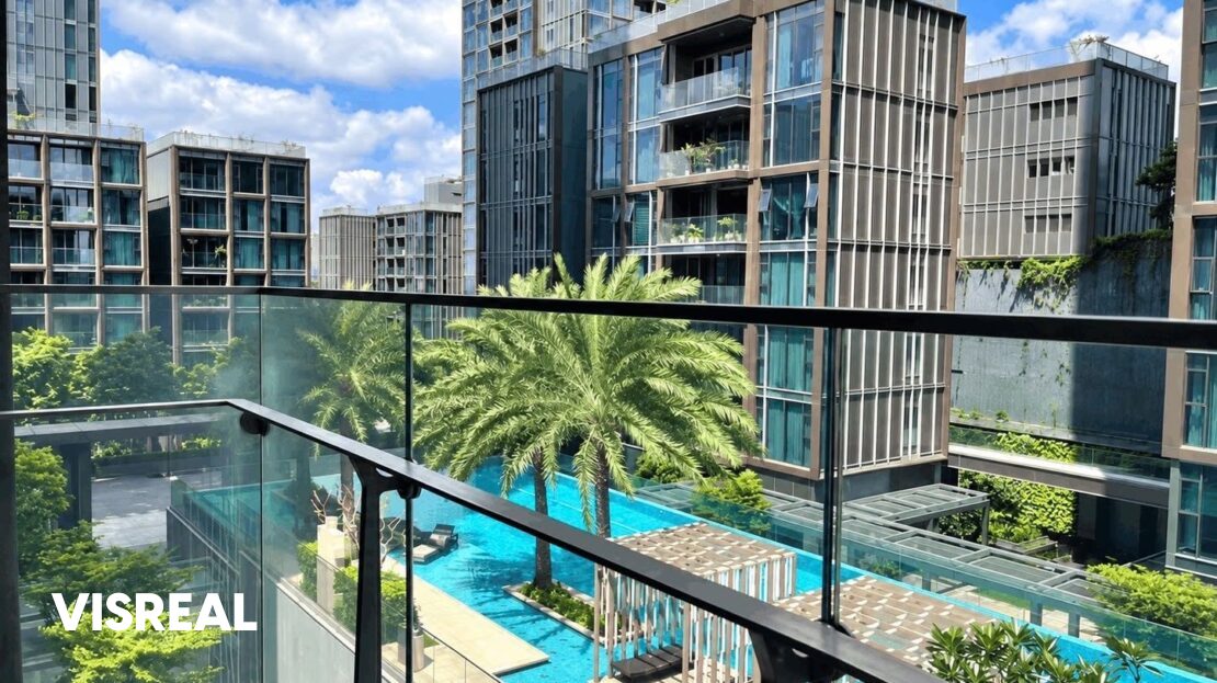 Balcony view over the palm-lined pool at Empire City