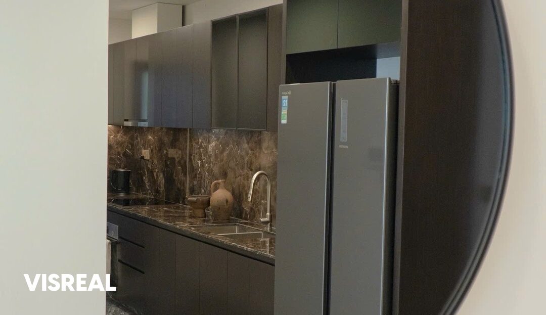 Kitchen reflected in the round wall mirror, 2-bedroom rental in Lumiere Riverside
