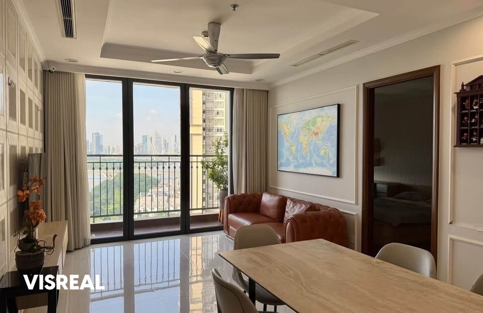 Leather chesterfield sofa and dining table with river and skyline view, Vinhomes Central Park 3BR