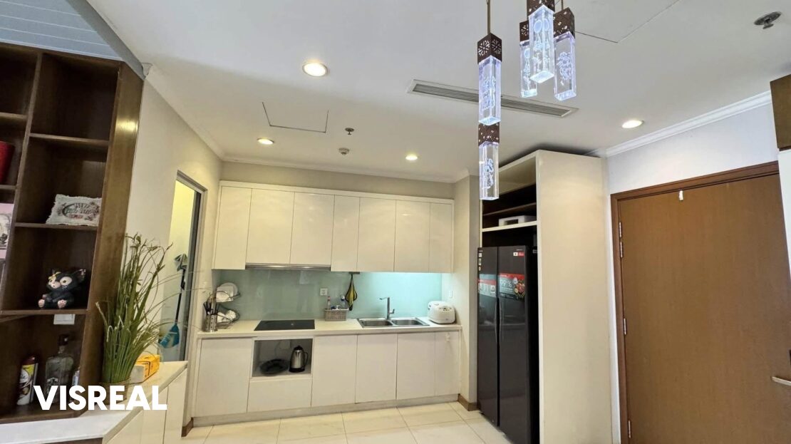 Kitchen and entrance door under glass pendant lights, Vinhomes Central Park rental