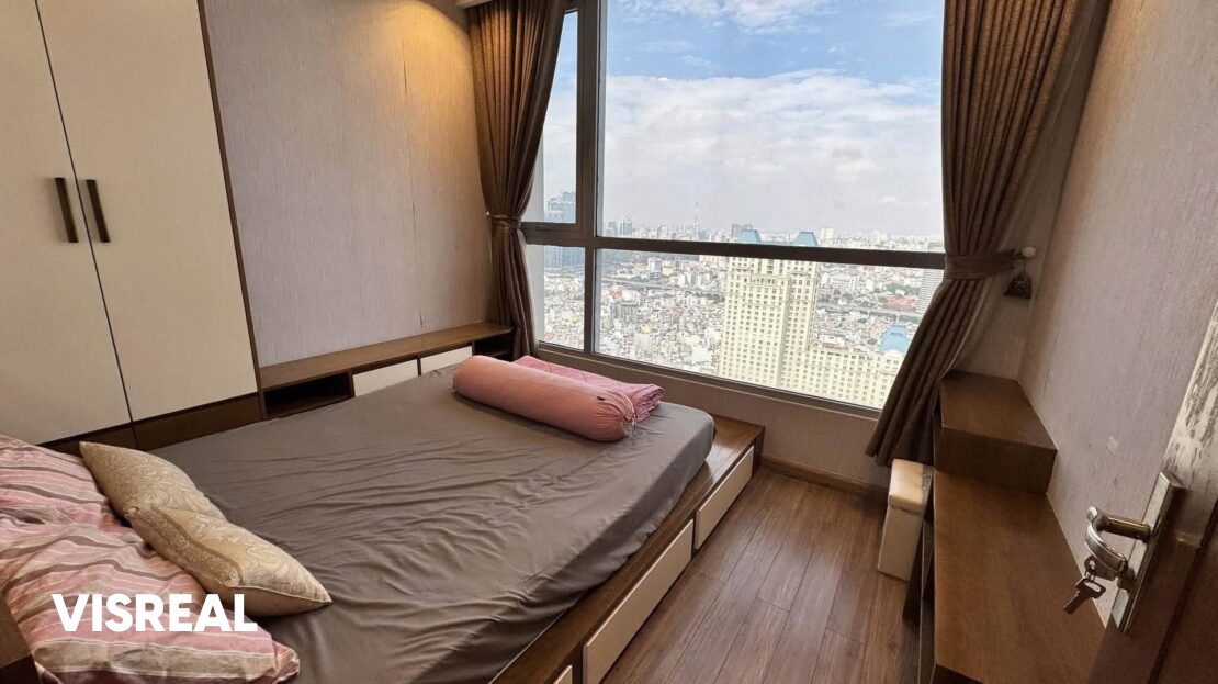 Second bedroom with platform bed and wide city-view window, high-floor Vinhomes Central Park apartment