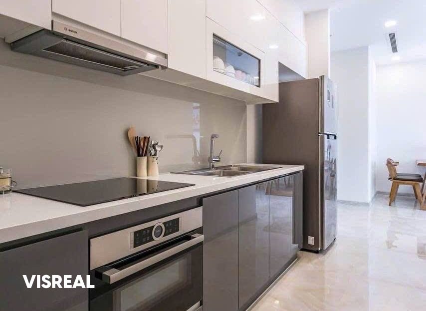 Kitchen with induction hob, built-in oven and large fridge, Vinhomes Golden River 2BR