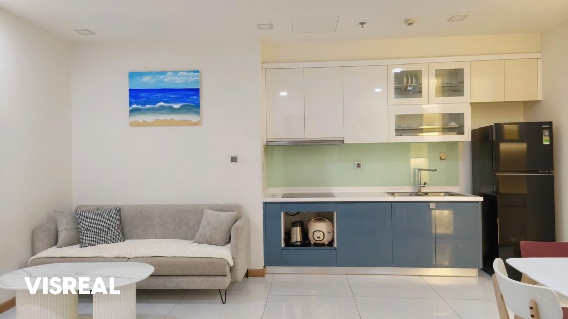 Blue and white kitchen with hob, double sink and Aqua fridge, Vinhomes Central Park 1-bedroom