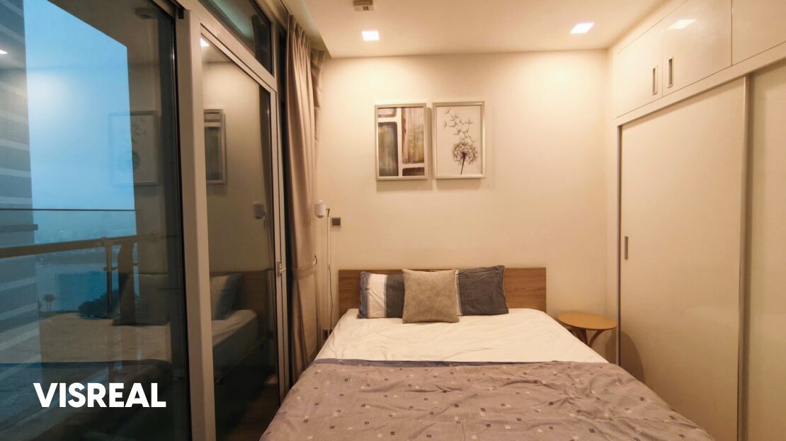 Bedroom with sliding glass doors to the balcony and built-in wardrobe, Vinhomes Central Park